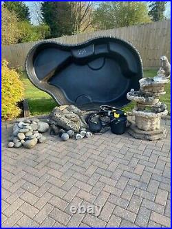 Preformed pond complete with pump, control panel, water fountain and ornaments